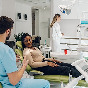 a dentist consulting with a patient about dental implants