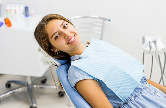 Relaxing woman in dental chair