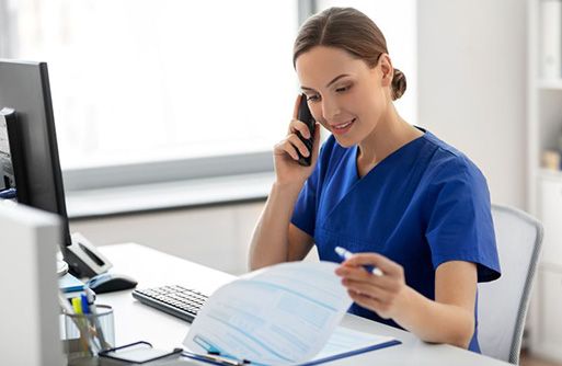 Dental team member reviewing insurance paperwork