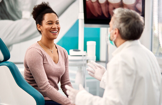 Dentist talking to a woman