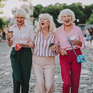 Woman laughing and drinking coffee
