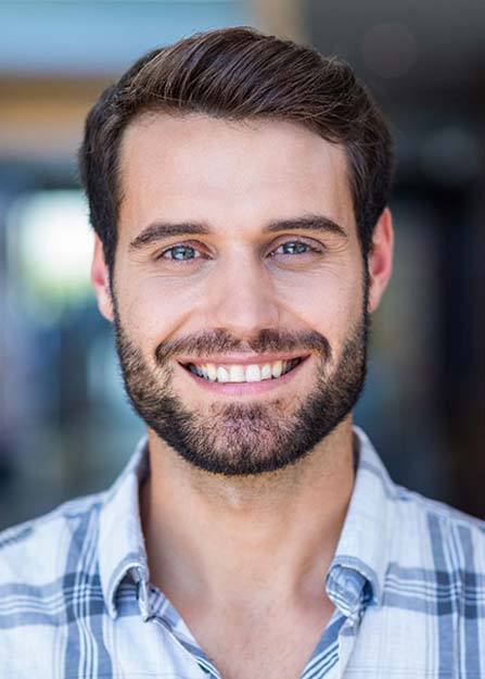 Man smiling after visiting emergency dentist in Lebanon