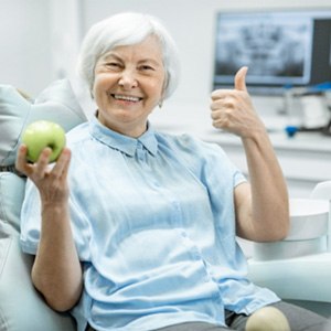 A closeup of a man biting an apple