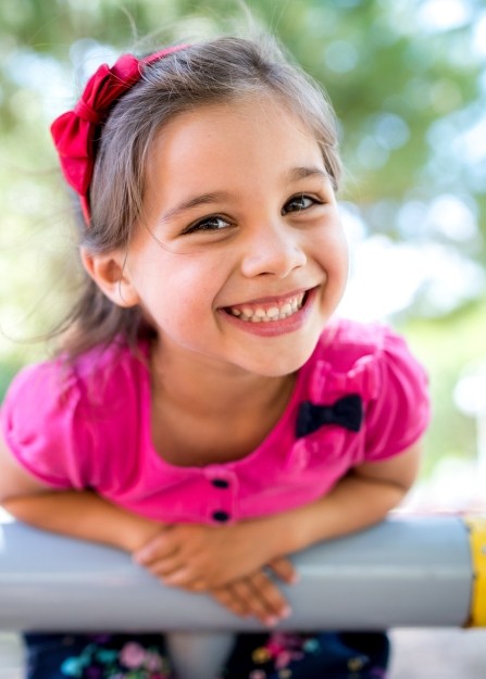 Litle girl sharing happy smile