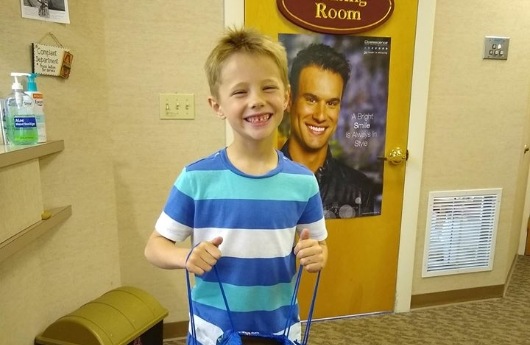 Smiling young boy in dental office