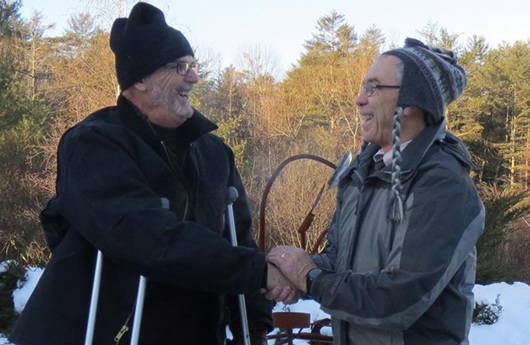 Dentist shaking hands with man outdoors