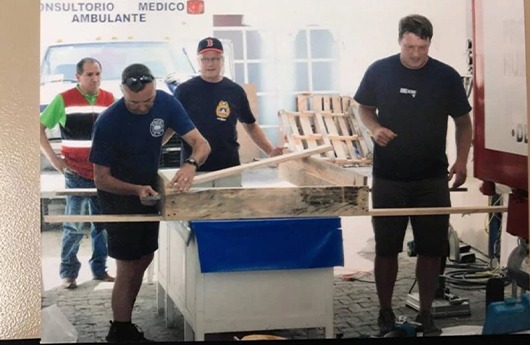 Volunteers setting up treatment area