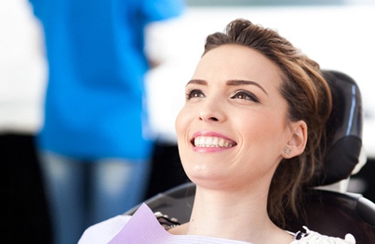 smiling woman sitting in dental chair