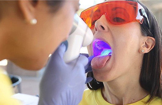 Patient receiving oral cancer screening