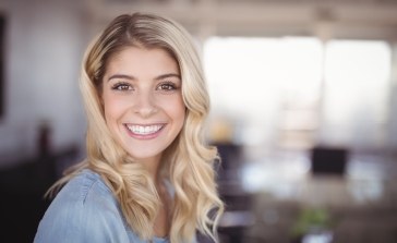 Woman with flawless smile after cosmetic dentistry