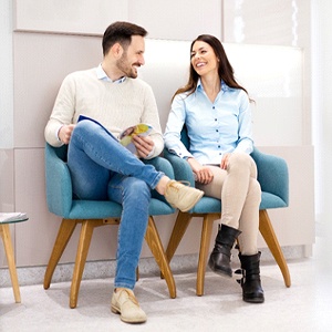 Couple reviewing paperwork at dental office